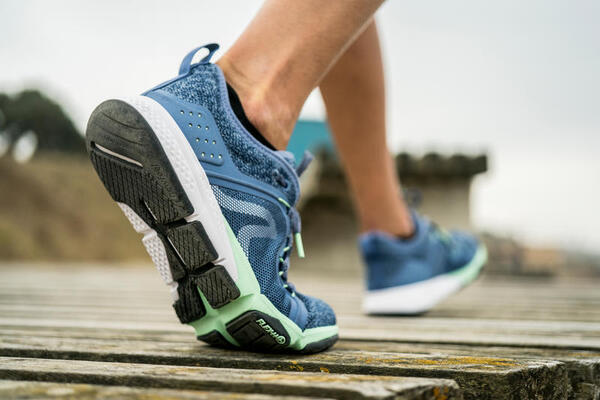 Comfortable walking shoes on a road ready for an easy stroll